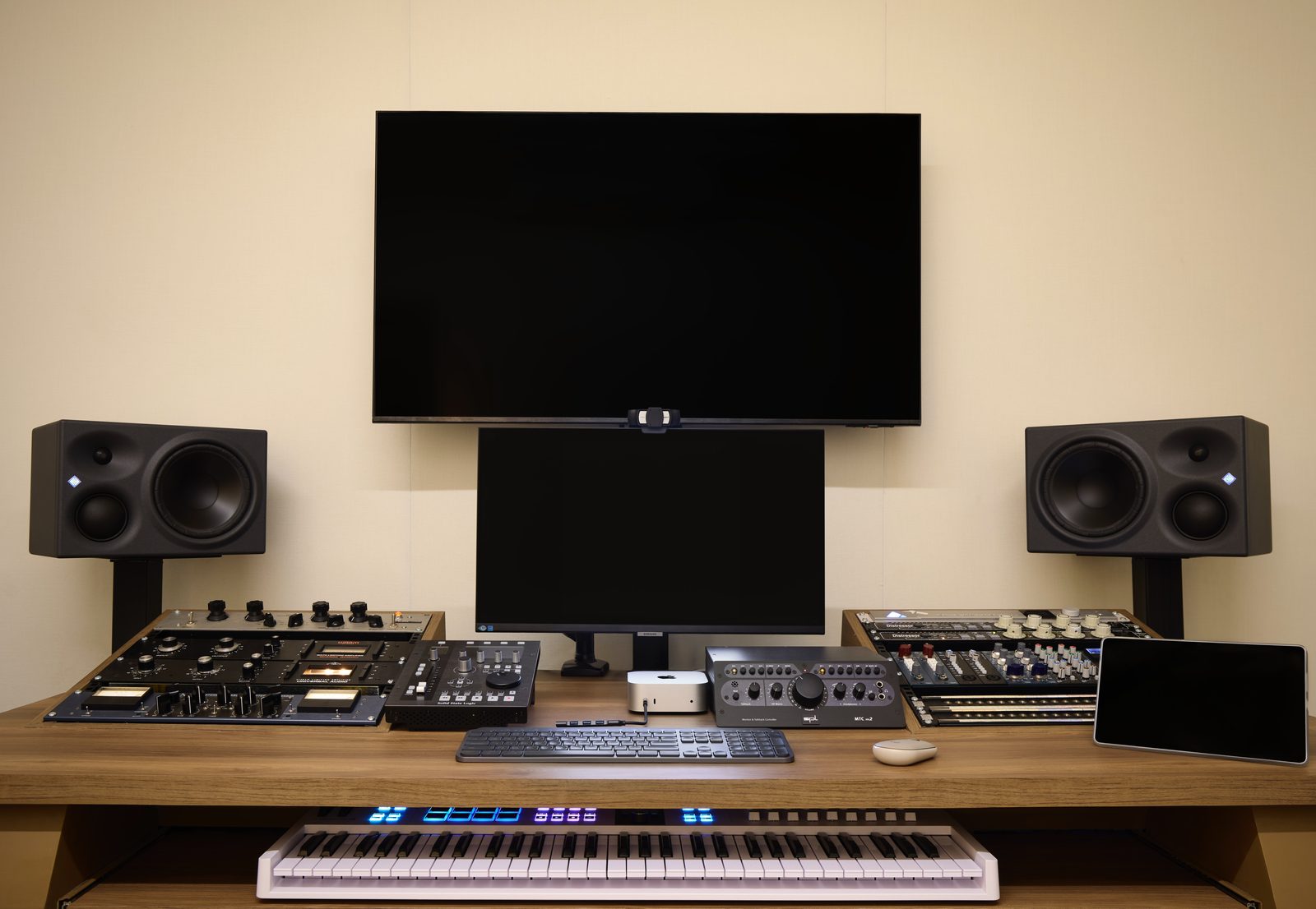 The control room at The White Room with the vocal booth beyond